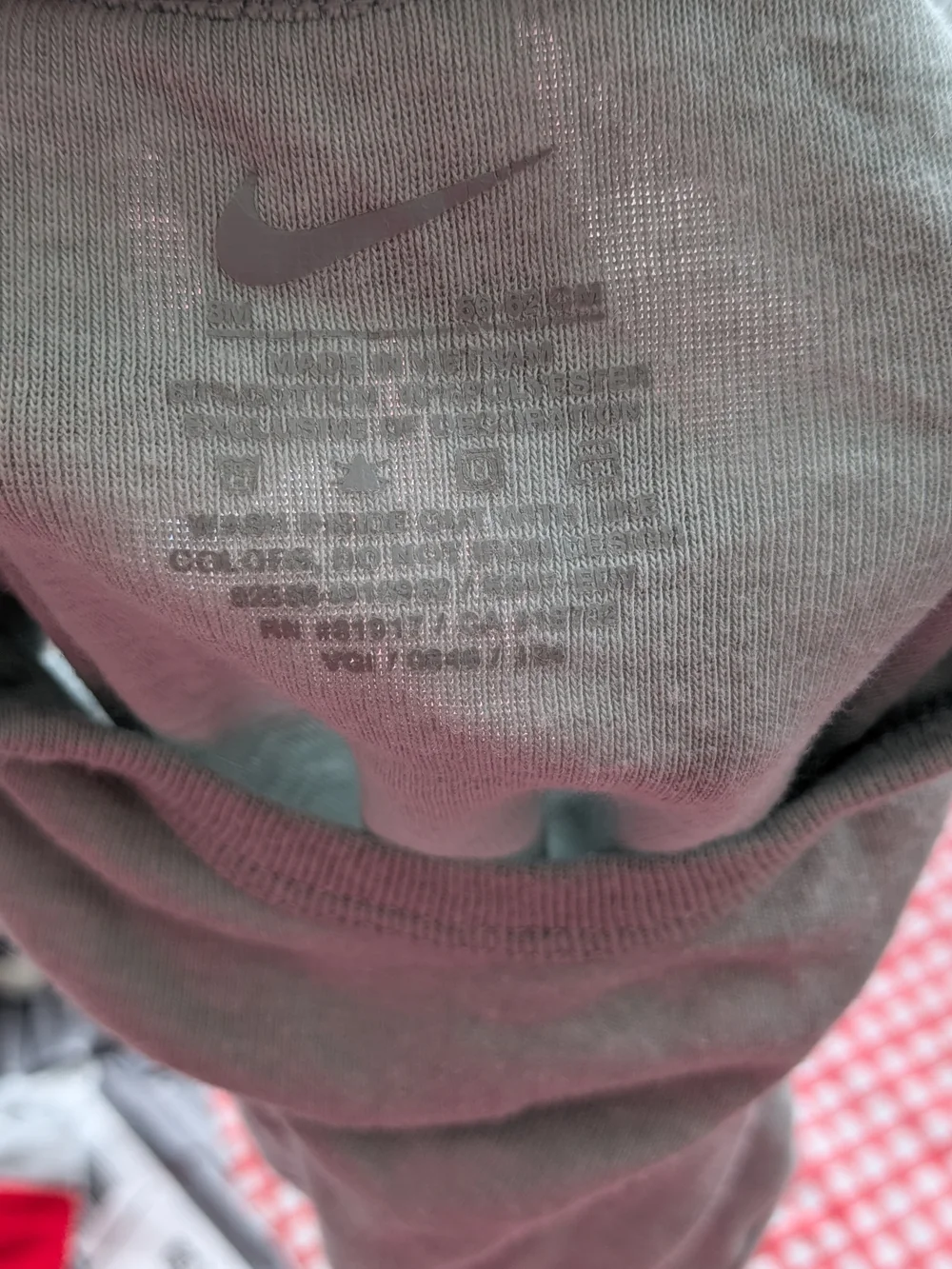 Nike Short-Sleeve Baby Onesies in Cream and Light Blue